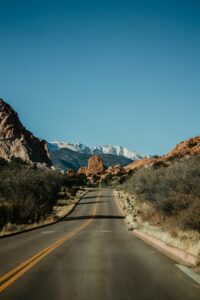 View looking down highway at mountains