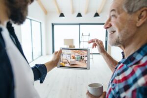 Two people planning future improvements to home after knowing the cost from having a home inspection.