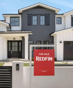 photo of townhome with redfin sign